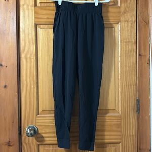 Nike dry-fit joggers in black.